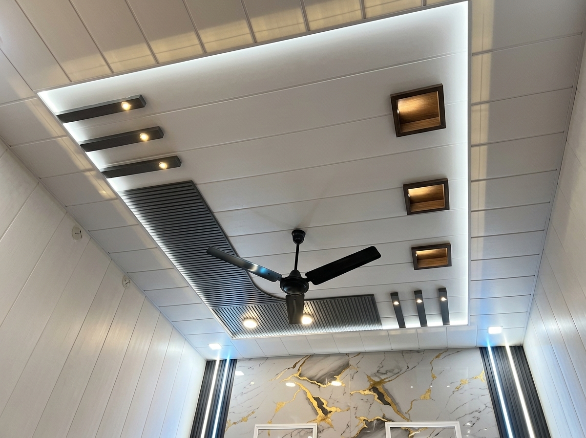 Modern Indian PVC false ceiling with charcoal louvers, square niche lights, and cove lighting